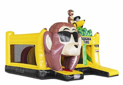 Commandez un château gonflable gonflable avec des obstacles et un toboggan sur le thème du singe banane